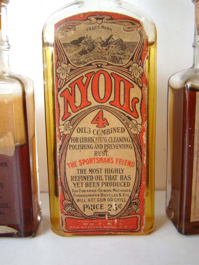 A RARE original Whale Oil display case for NYOIL containing 5 bottles circa 1890-1900 — image 3